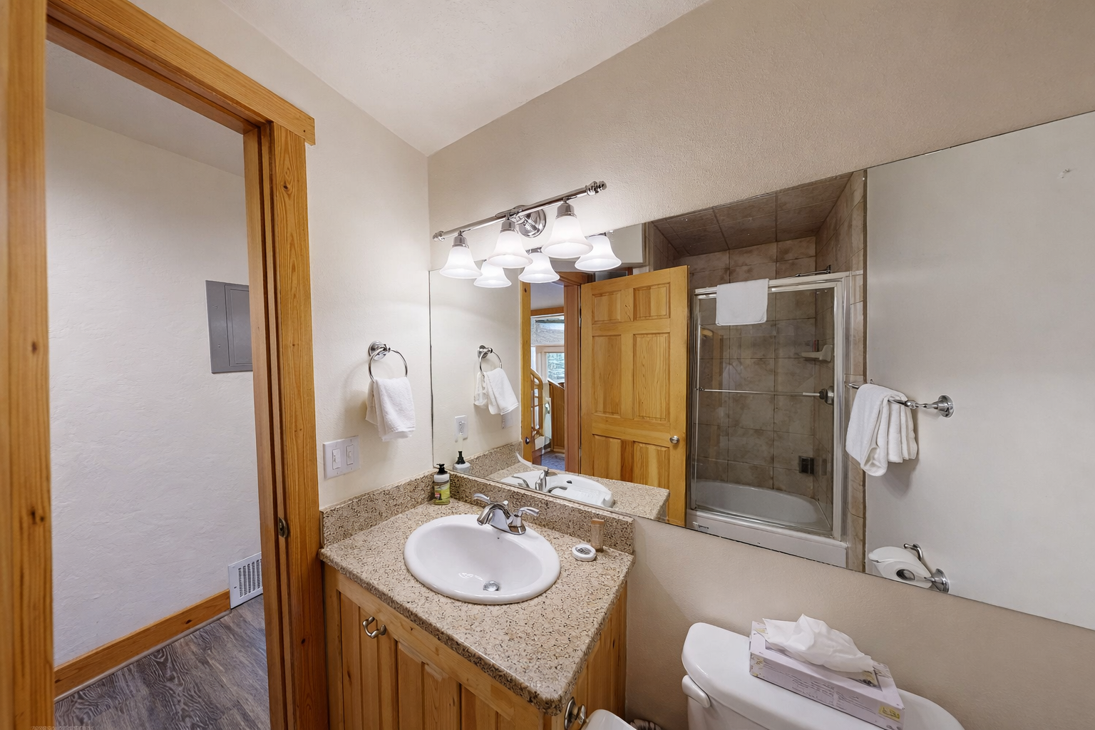 Your private bathroom features granite counters, modern fixtures, and a spacious glass shower for refreshing starts to mountain adventures.