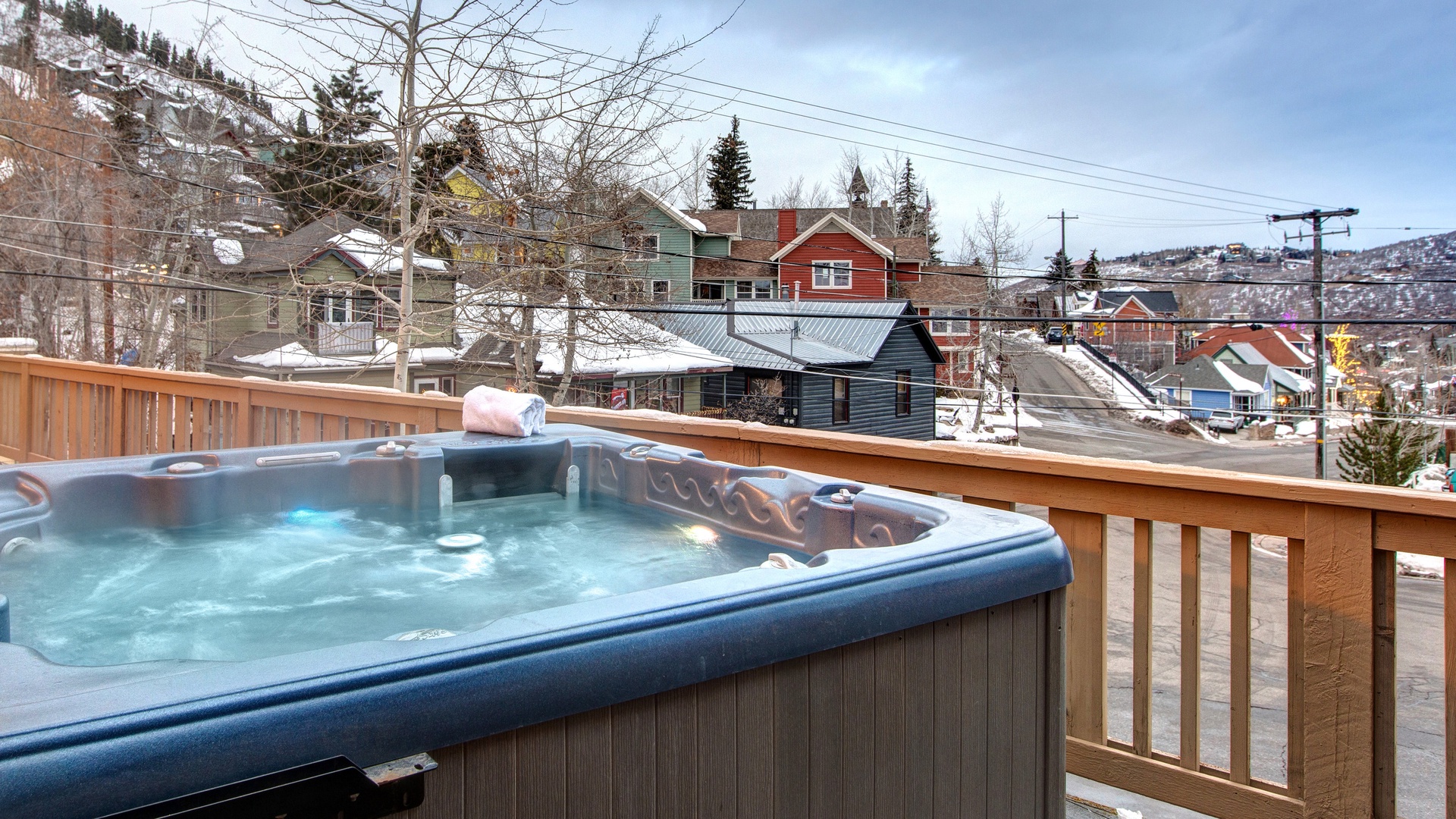 Soak in the bubbling hot tub while taking in stunning mountain town views from your private deck.