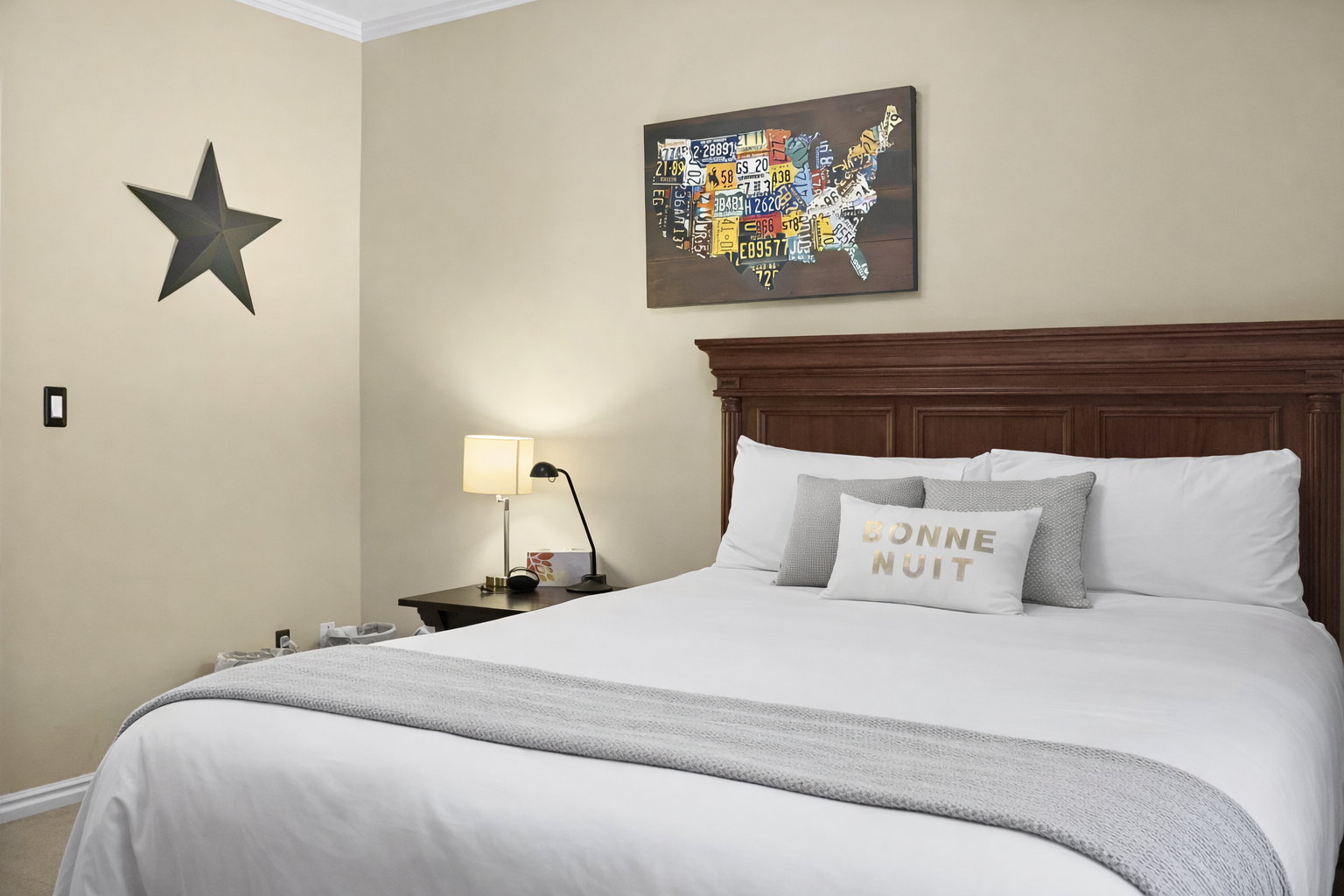 Sink into crisp white linens and colorful pillows in your beautifully appointed bedroom, complete with thoughtful bedside lighting for late-night reading.