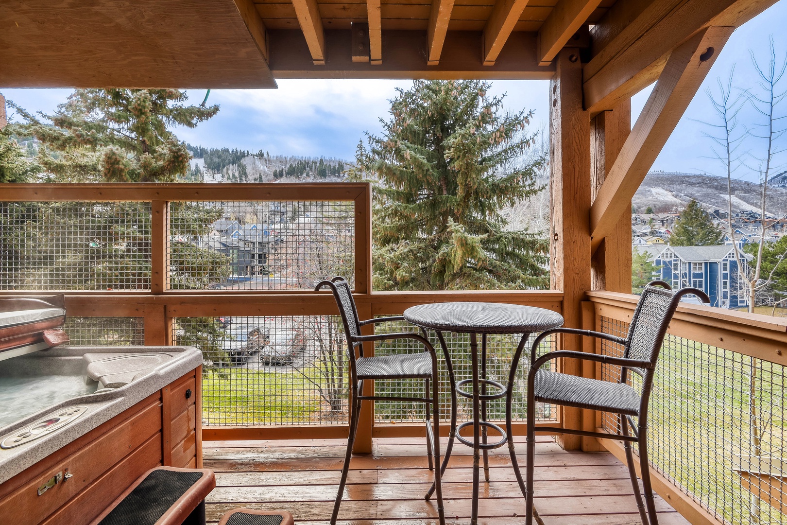 Relax on your private deck with mountain views, soak in the hot tub, and enjoy morning coffee at your bistro table.