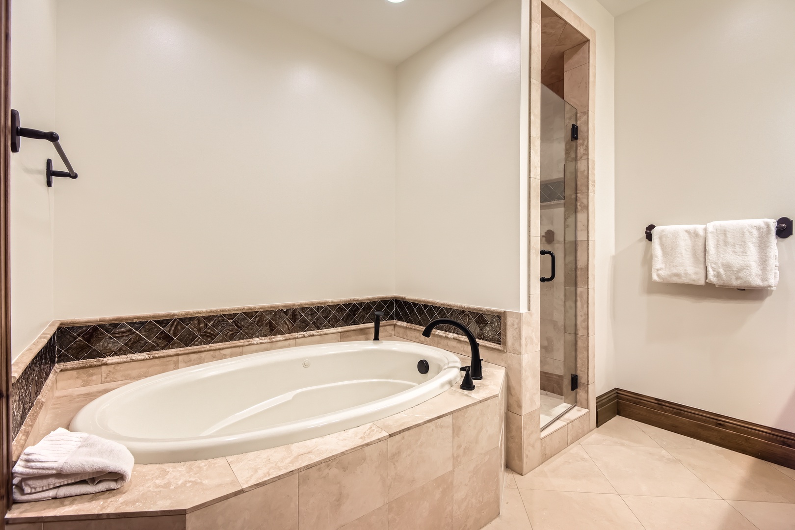 Unwind in your private spa-like bathroom, where a deep soaking tub and walk-in shower invite you to relax after a day of mountain adventure.