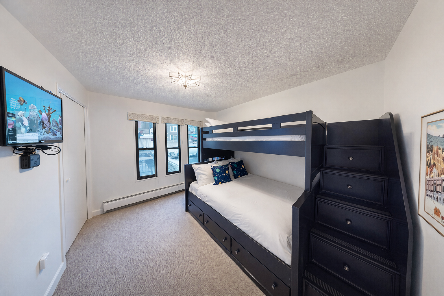 Your kids will love this cozy bunk bed retreat with built-in storage and entertainment, perfect for memorable family adventures.