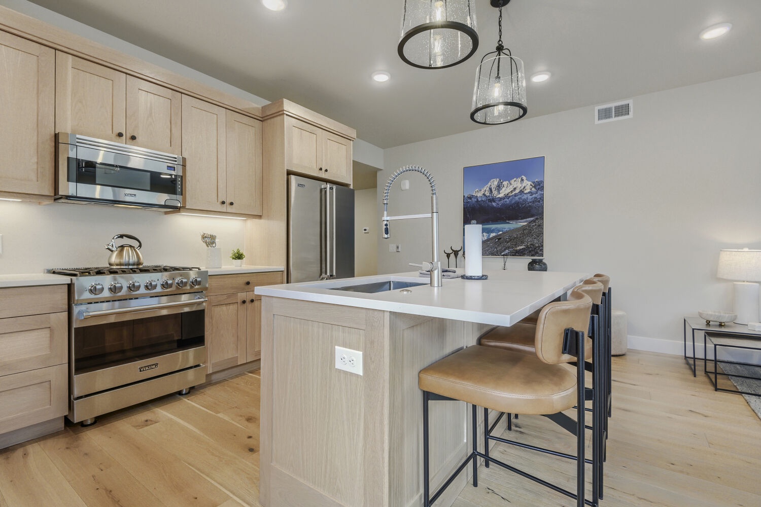 Your fully equipped kitchen invites culinary adventures with sleek stainless steel appliances, a spacious island, and custom cabinetry—everything you need to cook and gather comfortably.