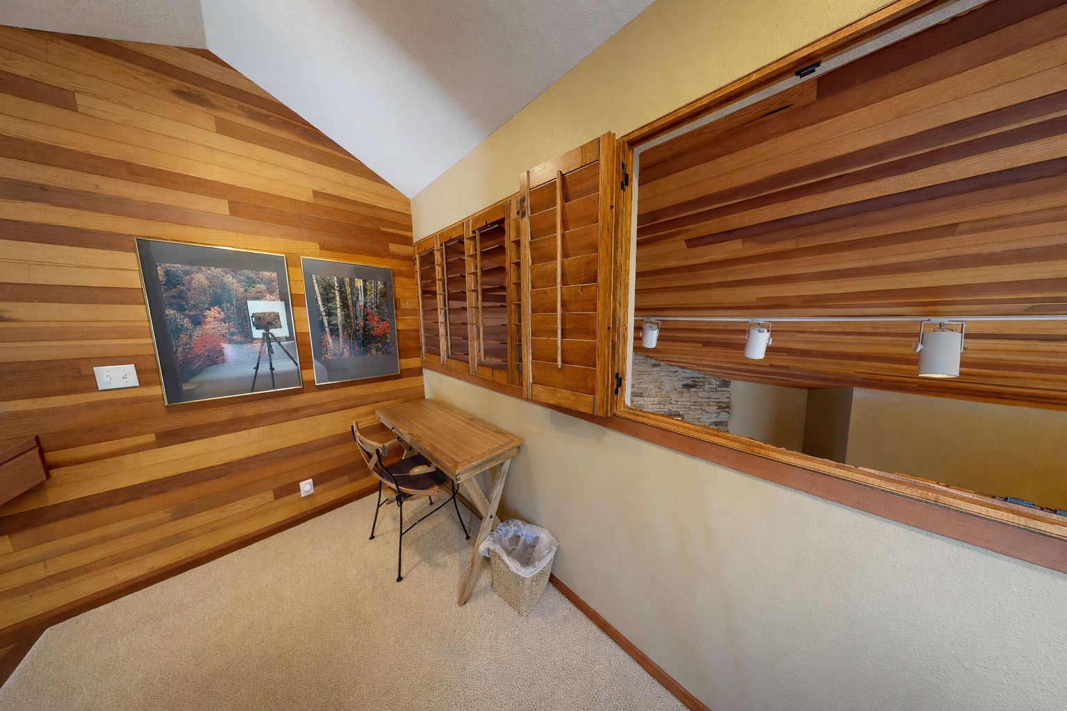 Your private workspace featuring warm wood walls, vintage lockers, and a cozy desk area perfect for quiet moments.