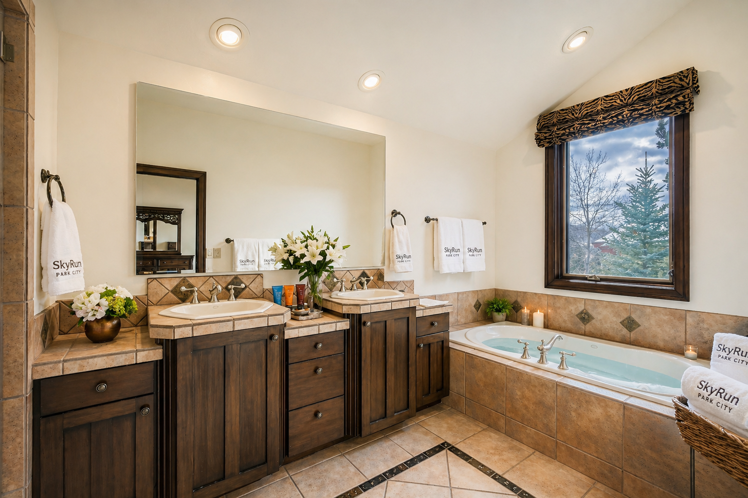 Sink into the soaking tub after a day of adventure, surrounded by warm stonework and a peaceful view. Fresh towels, soft candlelight, and dual vanities make your morning routine feel effortless.