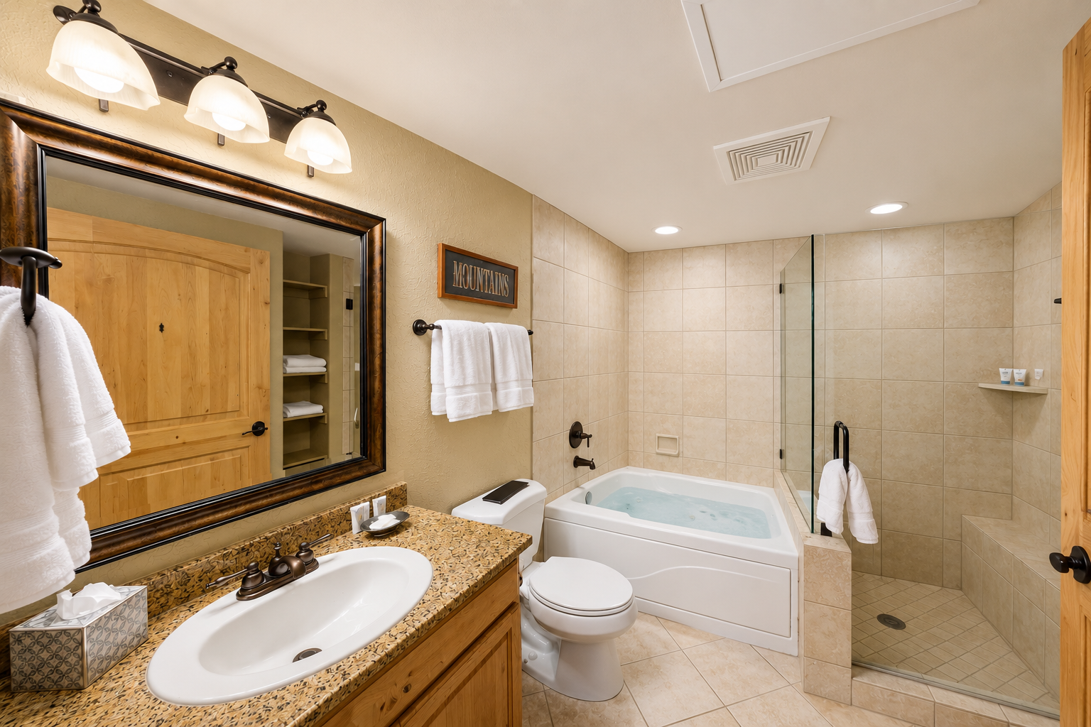 Unwind in your spacious bathroom with a soothing tub, walk-in shower, and granite vanity. Fresh towels and thoughtful touches make relaxation effortless.
