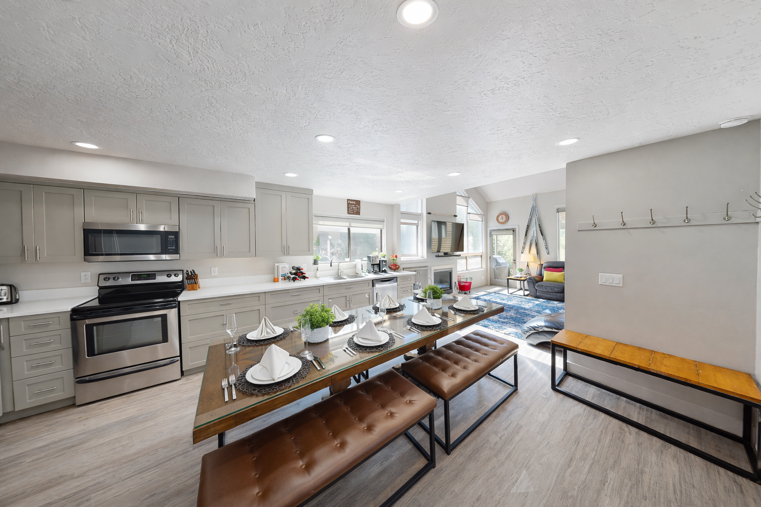 You'll love gathering in this bright, open kitchen and dining space with modern appliances and comfortable seating for memorable meals together.