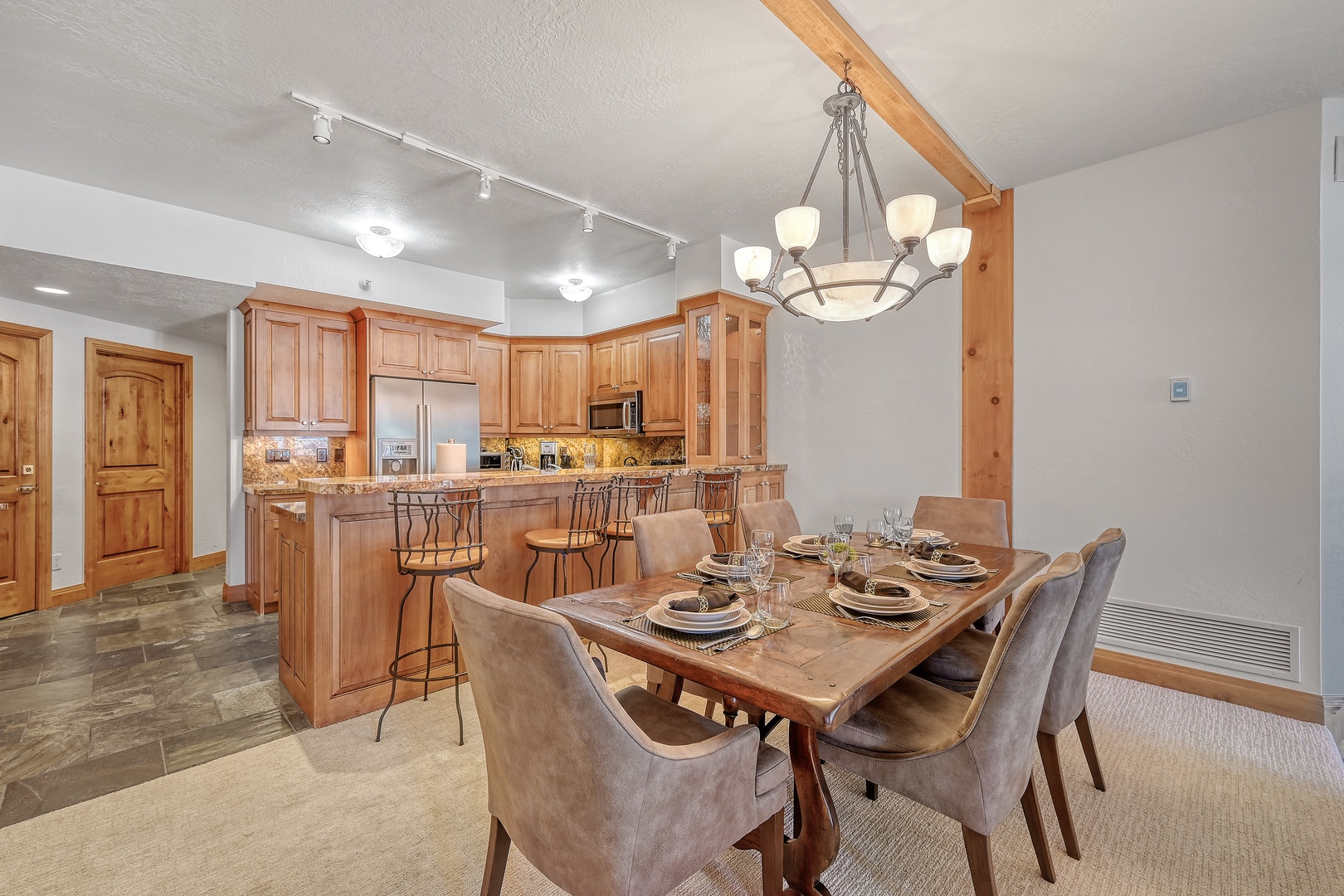 Gather around this beautiful dining table where you'll create lasting memories with family and friends in this warm, inviting space.