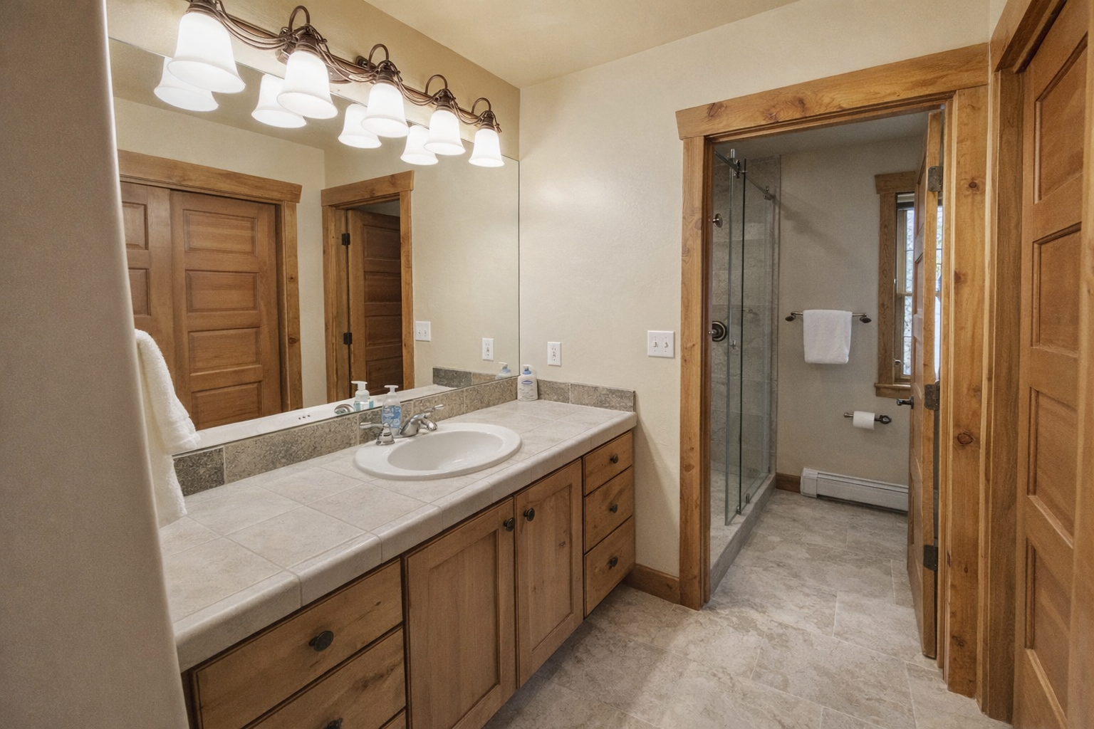 Relax in the large glass walk-in shower or enjoy the spacious wooden double vanity. It's the perfect spa-like retreat after exploring Park City.