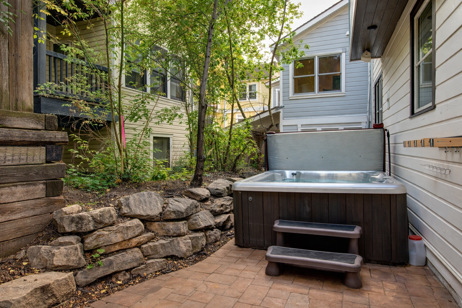 Unwind in the serene backyard oasis featuring a private hot tub, perfect for relaxing under the stars after a day of Park City adventures or ski-in/ski-out fun.