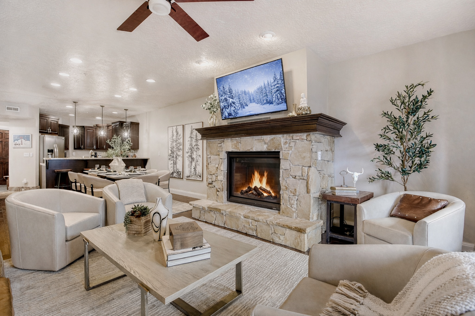 Cozy up by your crackling fireplace in this open living space with modern comfort and mountain charm.