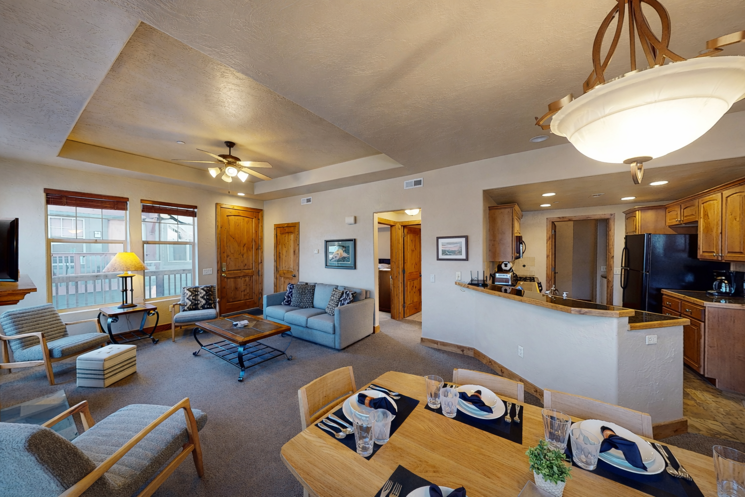 Your spacious open-concept living area flows seamlessly from cozy seating to a fully-equipped kitchen, perfect for memorable meals together.