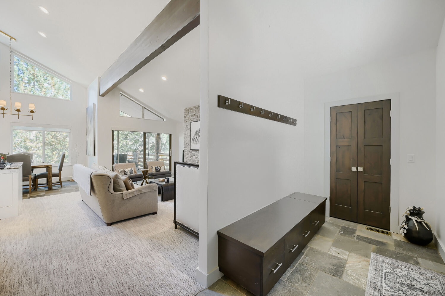 Step inside to find soaring ceilings and abundant natural light welcoming you into this beautifully designed mountain retreat, where modern elegance meets woodland serenity.