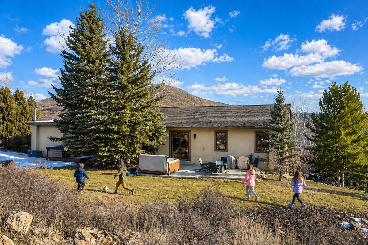 A private mountain retreat surrounded by natural beauty and mature trees, with spacious grounds where families can enjoy outdoor activities and relaxation.