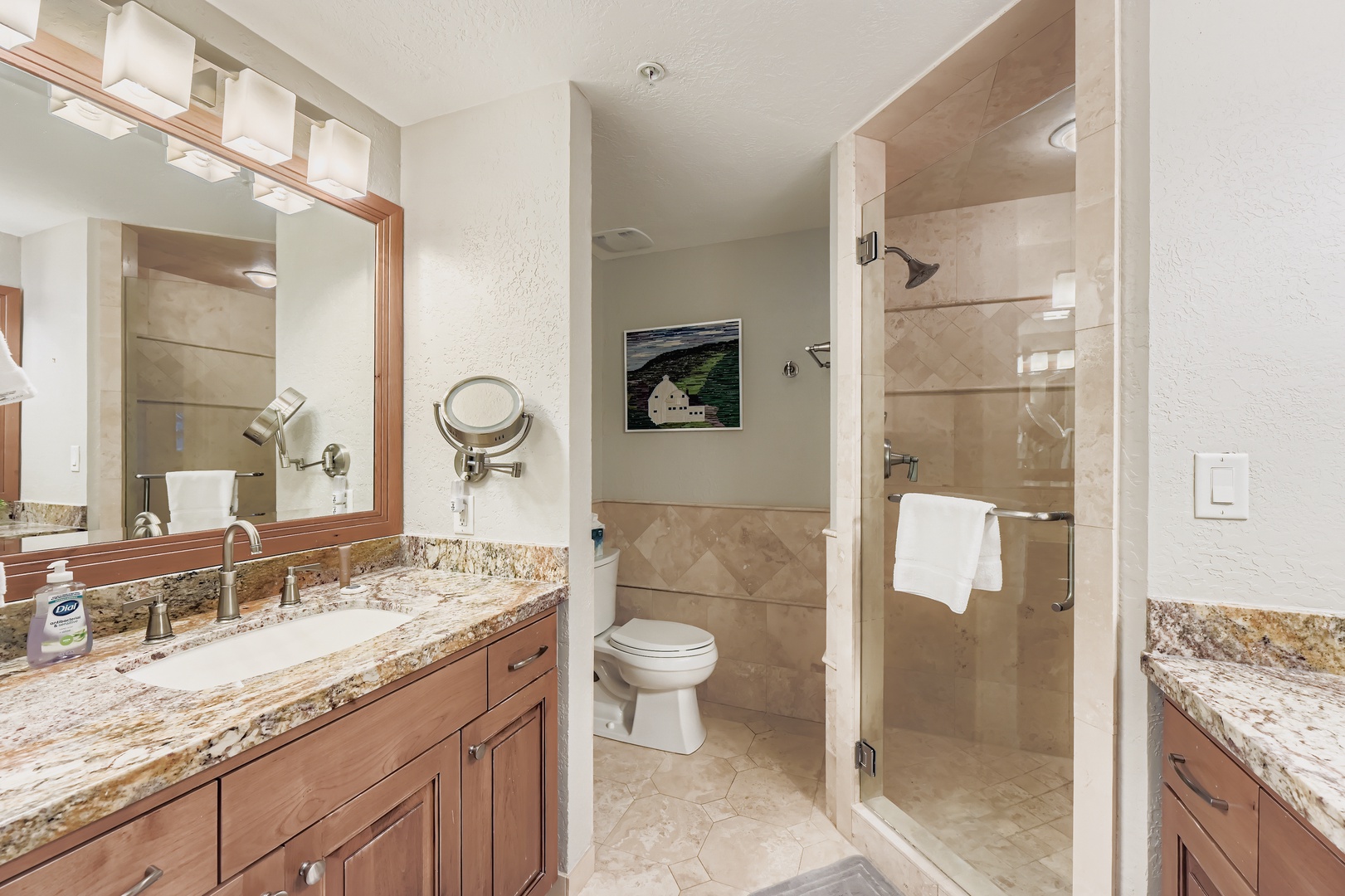You'll love this spacious bathroom with dual vanities, granite countertops, and a pristine walk-in shower—perfect for refreshing after your mountain adventures.