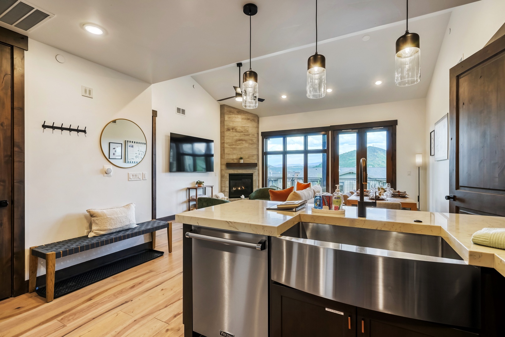 Step into an open-concept retreat where your mountain getaway unfolds. Cook in the sleek kitchen, relax by the fireplace, and soak in stunning views through floor-to-ceiling windows—all in one breathtaking space.