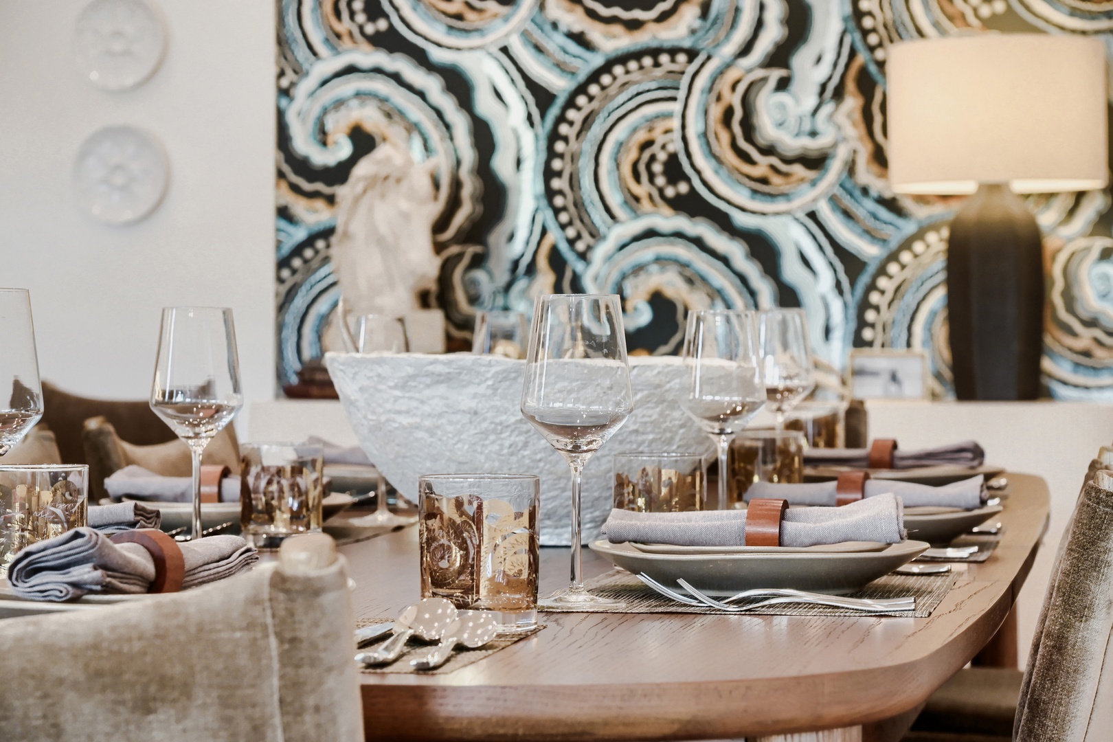 Your beautifully set dining table awaits, with elegant place settings and stylish accents creating the perfect backdrop for memorable meals together.