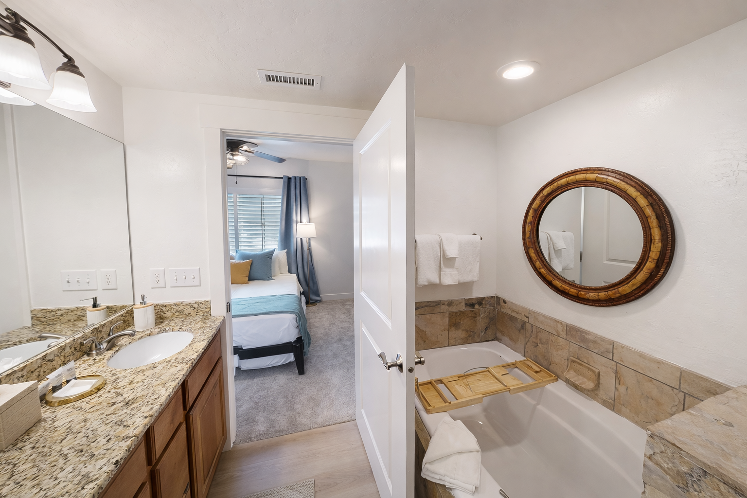 Unwind in this luxury master bath featuring a jetted soaker tub, walk-in glass shower, and custom stone tiling. A perfect spa-like retreat for your Park City getaway