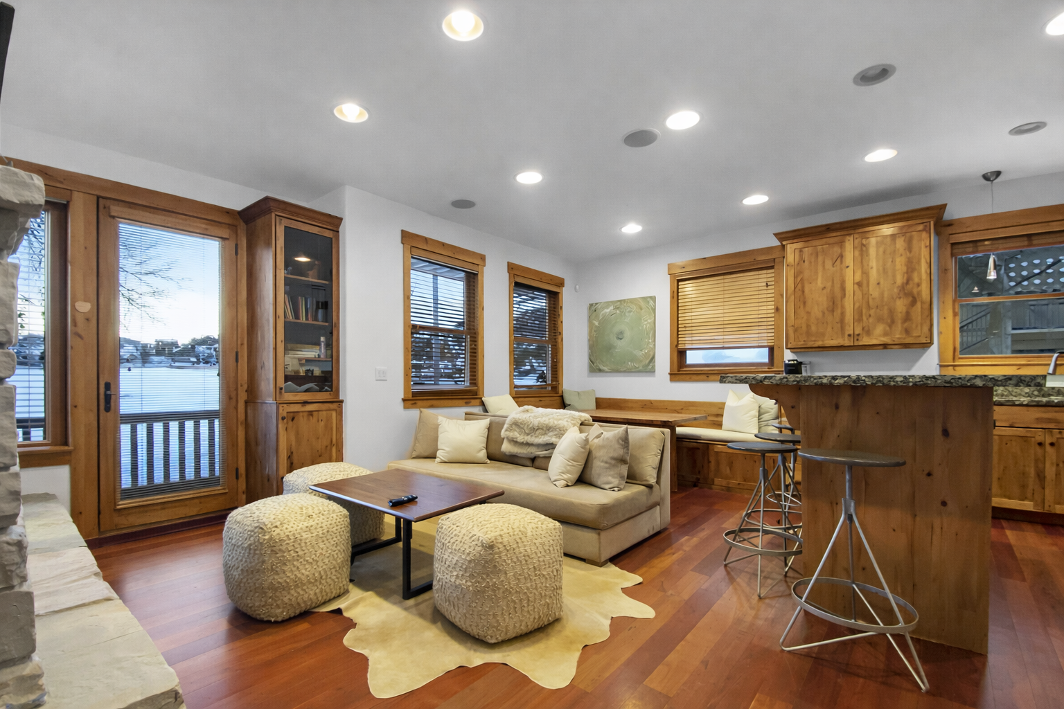 Unwind in this charming space with a plush sectional and an inviting atmosphere. Enjoy the stunning water views and step out onto your private balcony for some fresh air. Unit B