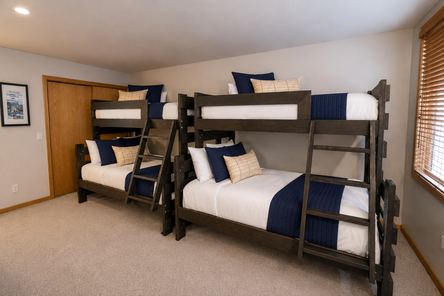 Two sturdy bunk bed sets dressed in crisp white linens and navy accents create a cozy space where your whole crew can rest after a day of adventures.