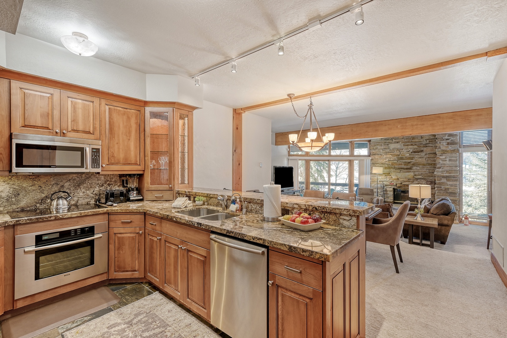 You'll love preparing meals in this stunning gourmet kitchen, featuring granite counters, and premium appliances.