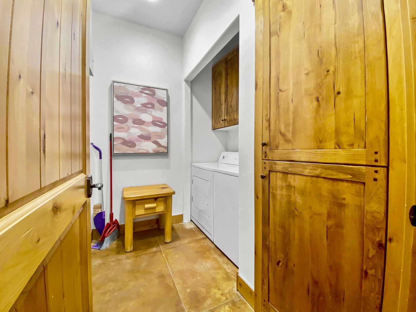 Enjoy the convenience of an in-unit washer and dryer in this charming, rustic space with warm wood details. The perfect amenity for longer stays after a day of adventure. Unit B