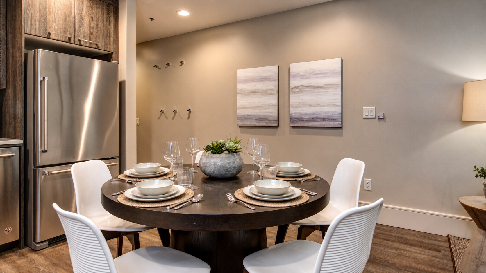 Enjoy our fully equipped kitchen with modern stainless steel appliances and a comfortable round dining table. This bright, efficient space is perfect for meals during your stay.