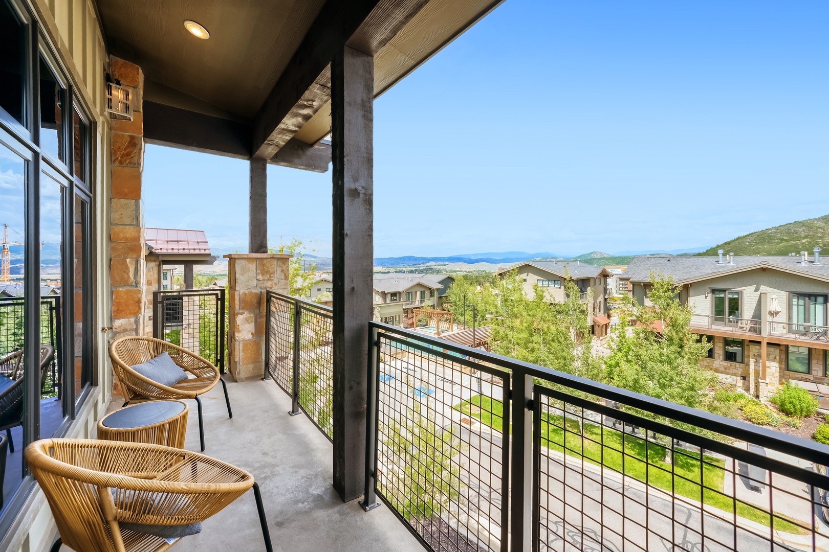 Step onto your private balcony and take in sweeping mountain and valley views. Relax in the comfortable seating while enjoying fresh air and the peaceful landscape around you.