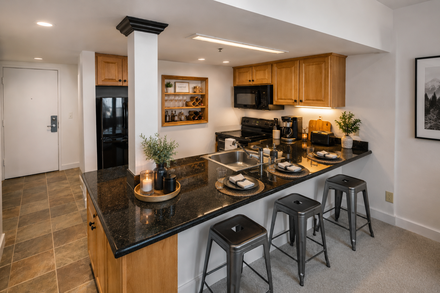 Your stylish open kitchen features warm wood cabinetry, sleek granite countertops, and a breakfast bar for casual dining. Modern appliances and thoughtful touches make meal prep effortless and enjoyable.