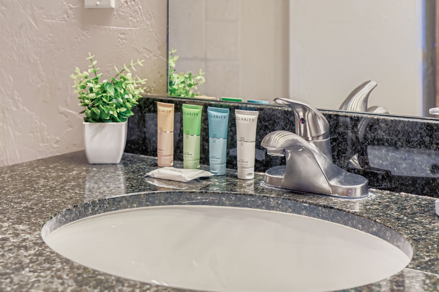 Your bathroom features quality toiletries and a granite countertop with modern fixtures for your comfort and convenience.