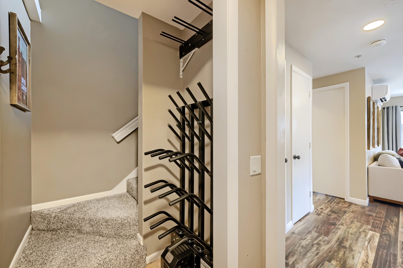 A bright, open hallway connects your private spaces with thoughtful touches like climate control overhead and plenty of storage tucked away behind clean lines and neutral tones.