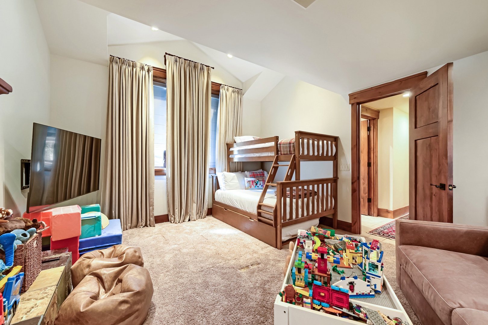 Your family will love this bright, spacious bedroom designed just for kids, with cozy bunk beds, plenty of toys, and room to play and unwind together after a day of adventure.