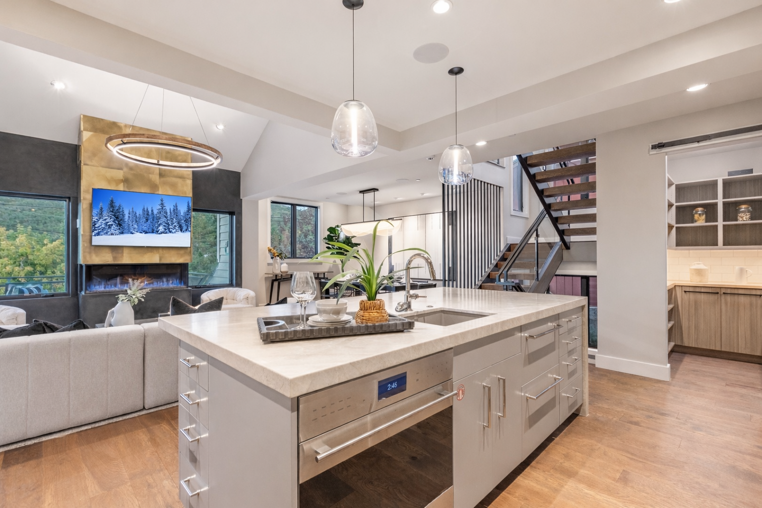 Whip up a gourmet meal in this fully-equipped kitchen featuring a large island, granite countertops, and bar seating.