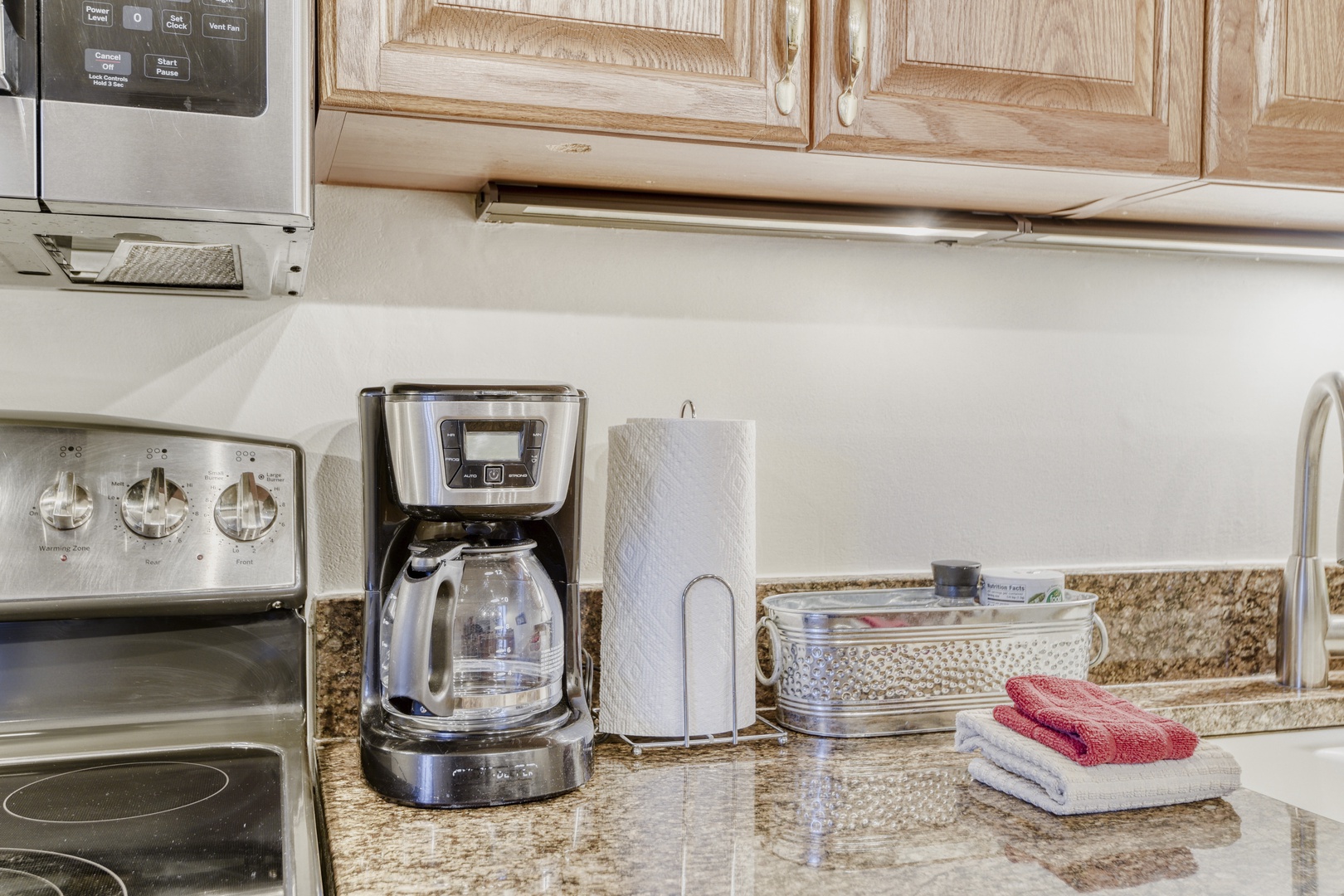 Start your morning right with fresh coffee from your well-equipped kitchen, complete with granite counters and modern appliances for all your cooking needs.