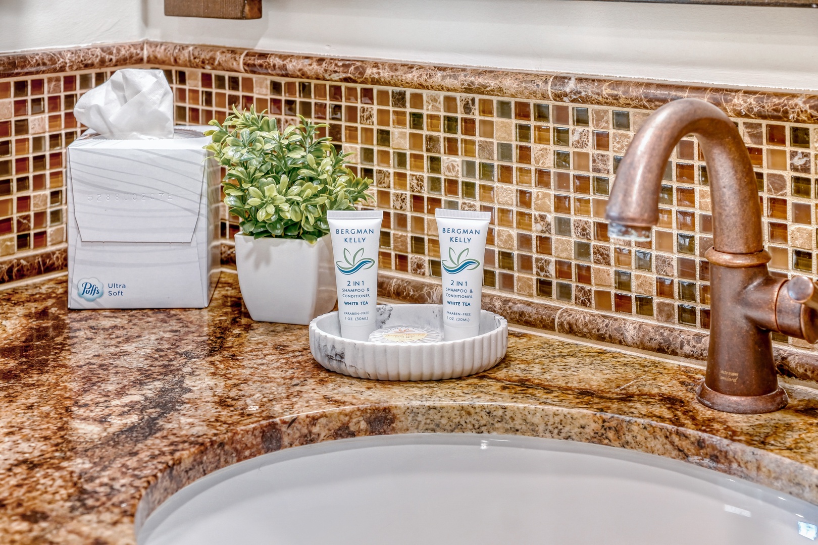 Your bathroom vanity is thoughtfully appointed with premium Bergman Kelly toiletries and soft tissues, creating a spa-like retreat for your daily routine.