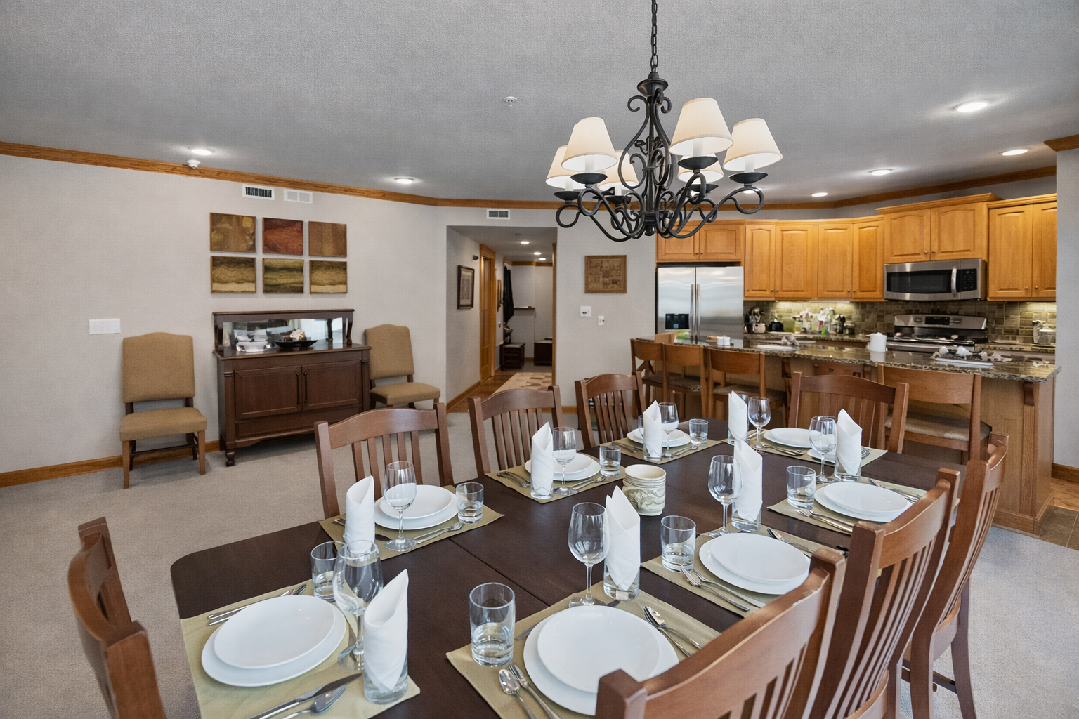 Spacious dining area perfect for group meals. Fully set table and easy access to the kitchen make entertaining a breeze. Enjoy shared dinners during your stay.