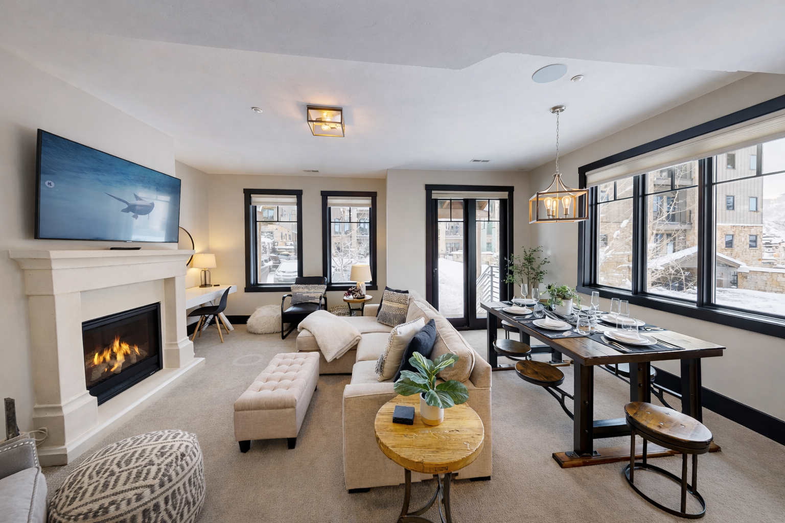 Cozy up by your crackling fireplace while winter views frame your elegant retreat, complete with plush seating and modern comforts.