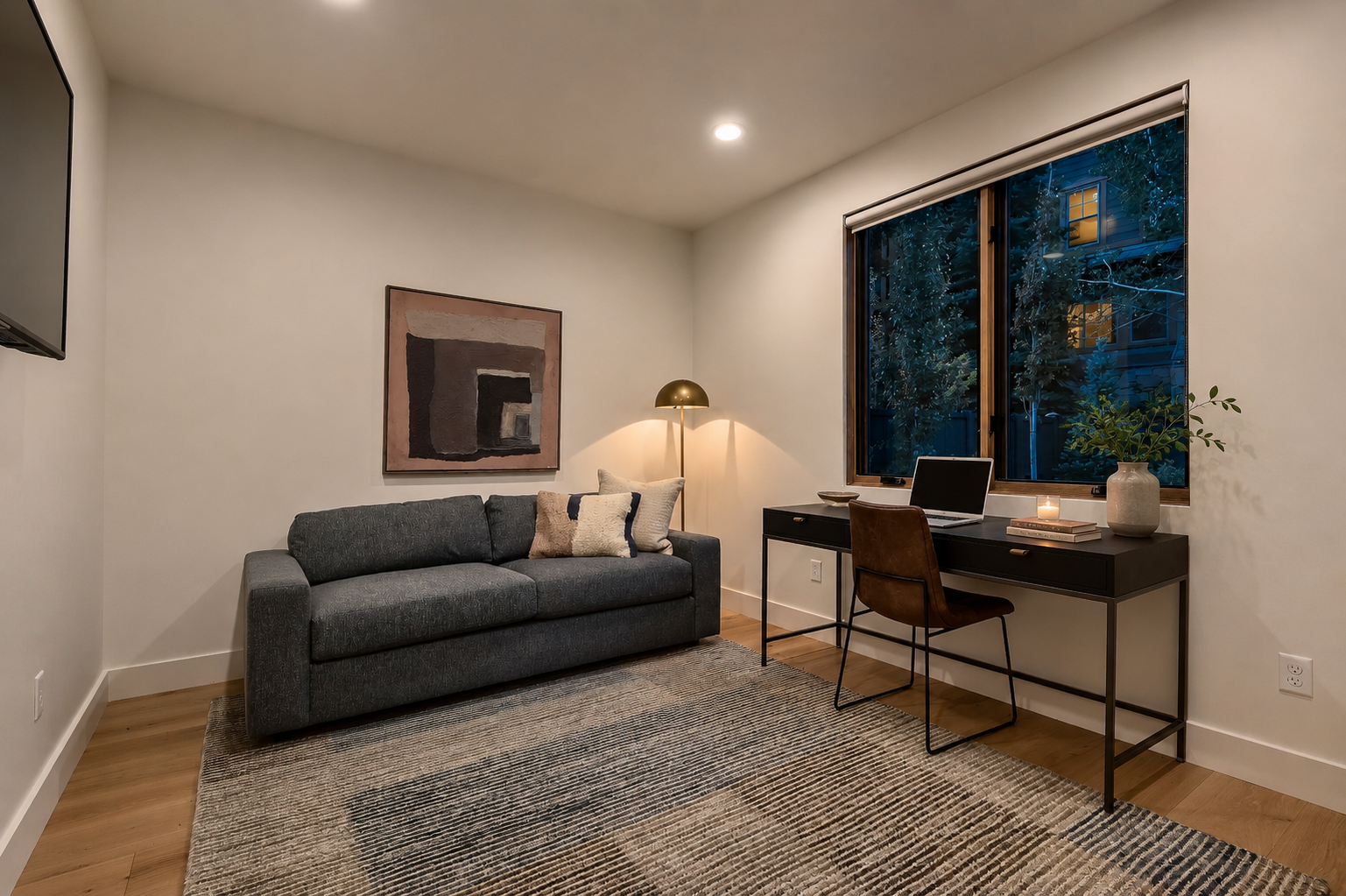 Your dedicated workspace features a sleek desk by the window and a cozy sofa for breaks—perfectly balanced for productivity and relaxation during your stay.