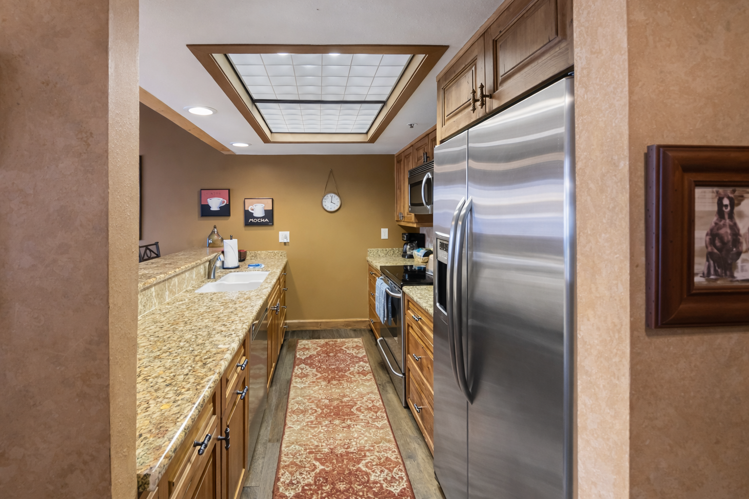 Your fully-equipped galley kitchen features stainless steel appliances and granite countertops, perfect for preparing meals during your stay.