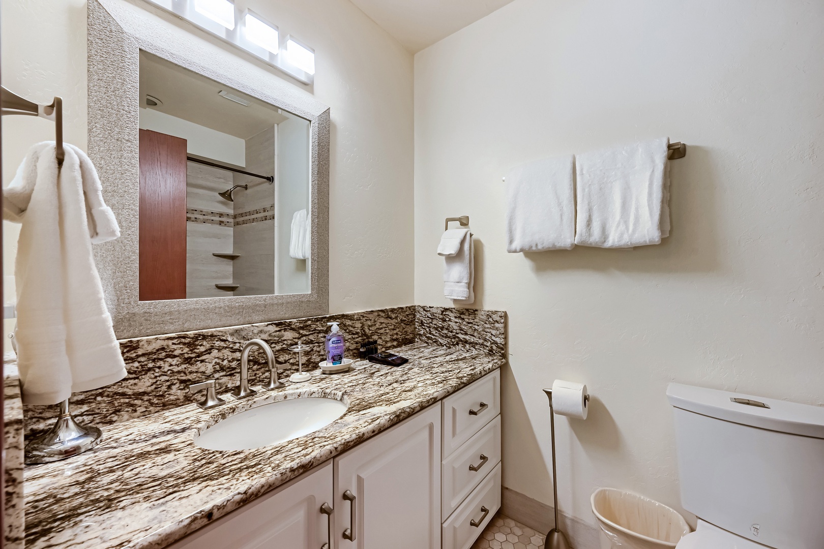 Bathroom with Large Vanity Sink and Mirror to get ready for you day or to clean up after a long day on the hill. Stocked with Towels and toiletries
