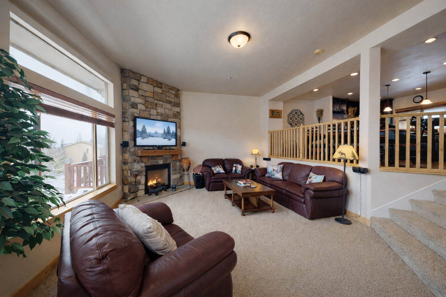Unwind in this spacious mountain retreat featuring plush leather seating and a cozy stone fireplace. Large windows frame stunning views, making it the perfect year-round Park City escape.