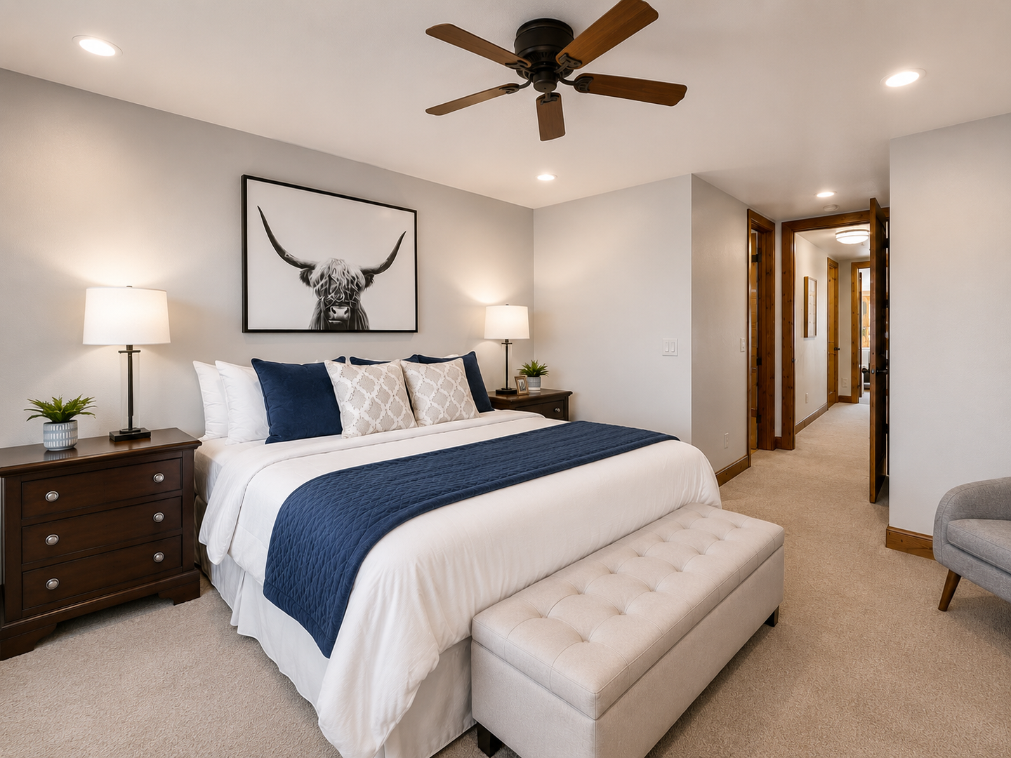Drift off to restful sleep in your serene bedroom, featuring a plush bed, stylish decor, and a gentle ceiling fan to keep you cool throughout the night.