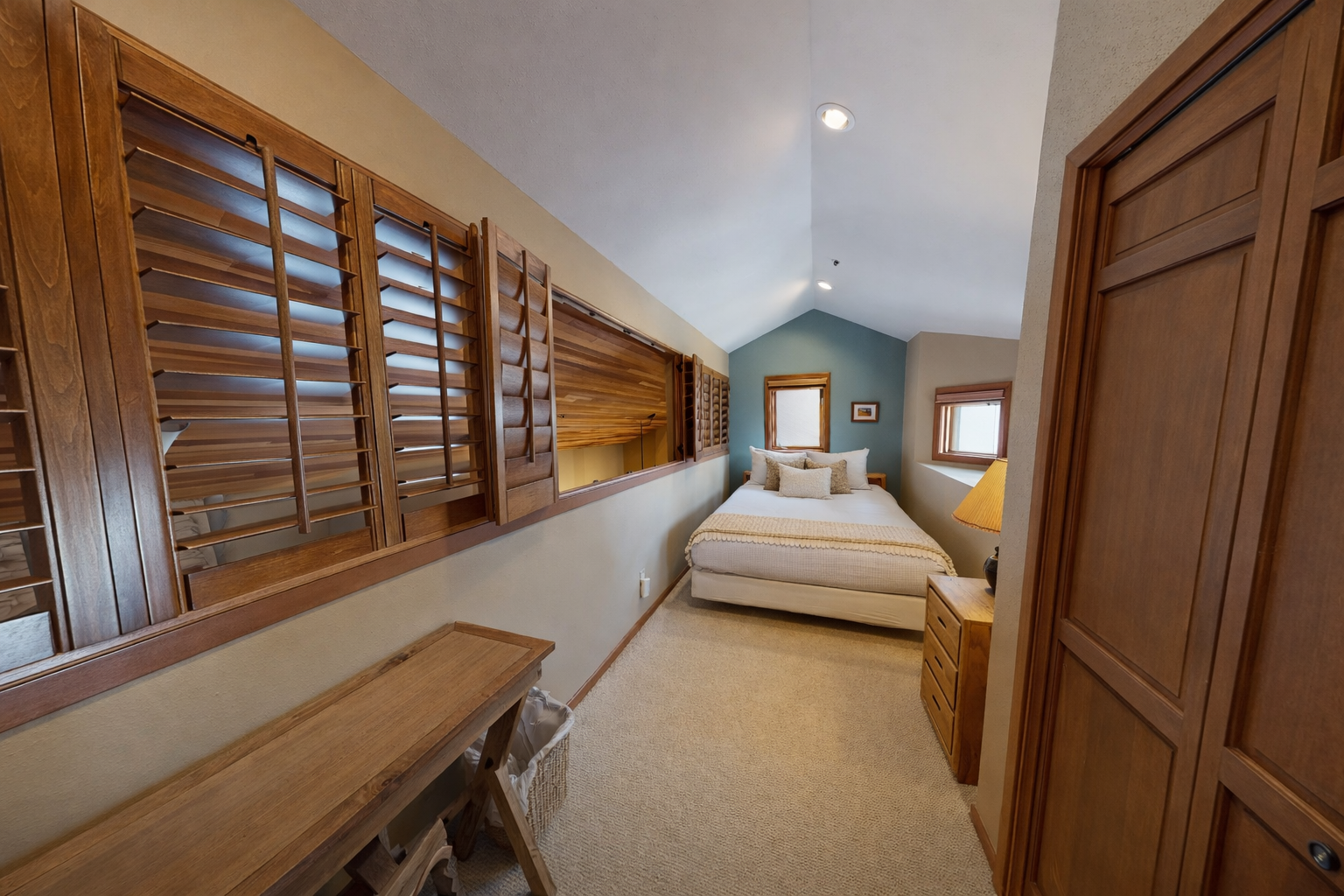 Step into your serene bedroom with warm wood finishes, cozy bedding, and thoughtful lighting that creates the perfect retreat.