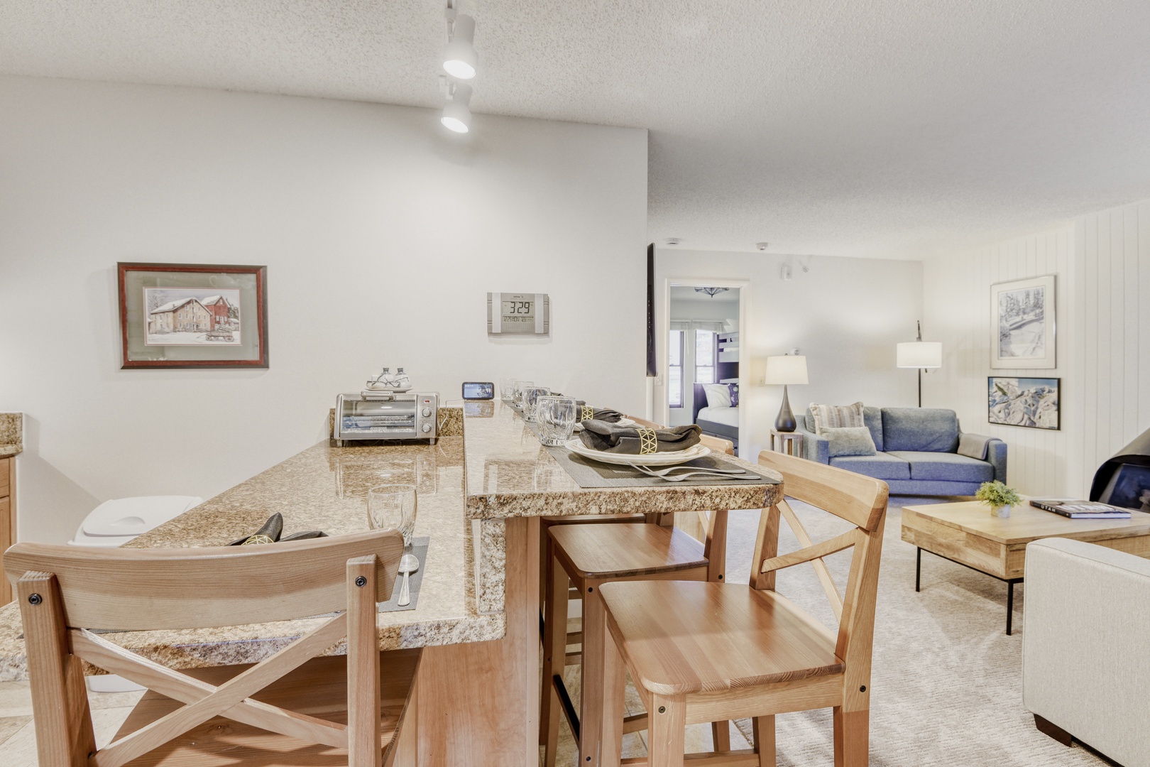 Your open-concept kitchen flows seamlessly into the living area, creating perfect spaces for cooking together and unwinding after busy days exploring.