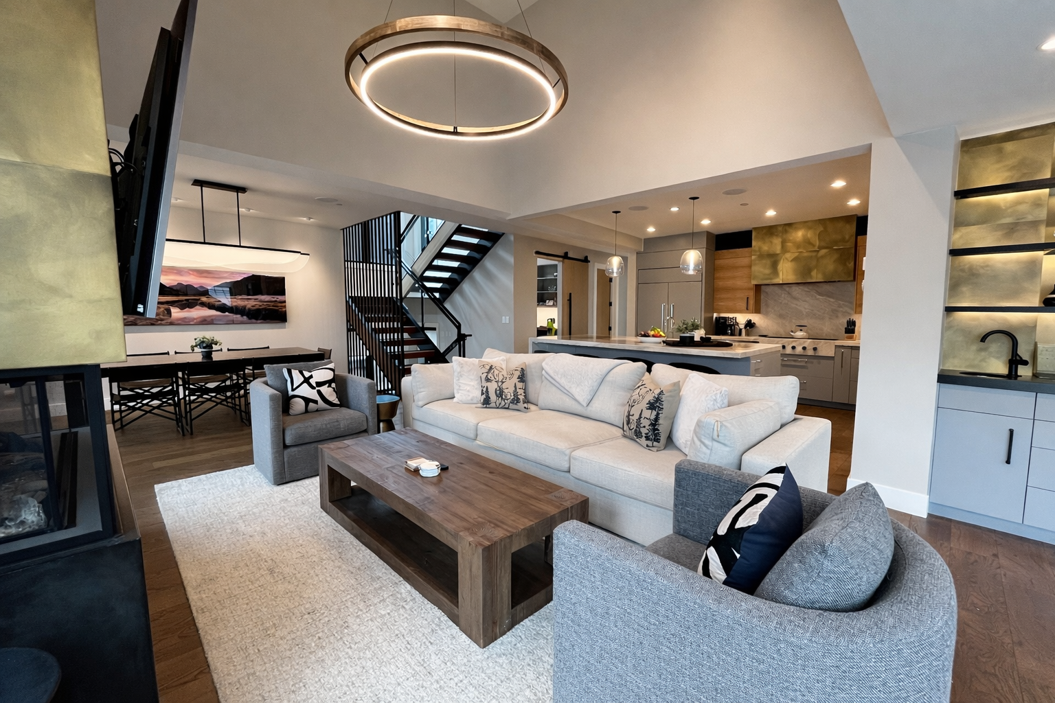 Unwind in this sophisticated living room where modern elegance meets mountain charm, complete with a cozy fireplace and stunning views.