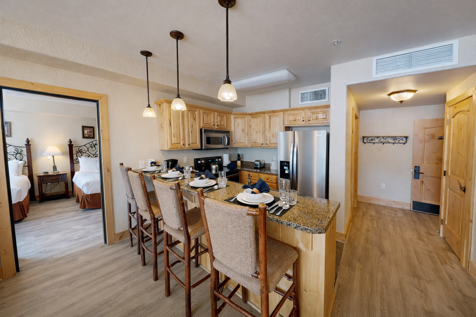 Whip up gourmet meals in this fully equipped kitchen featuring sleek granite countertops, modern stainless steel appliances, and elegant pendant lighting. The open layout makes hosting a breeze!