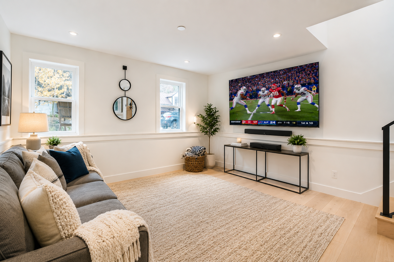 Sink into the plush sofa and enjoy your favorite game on the big screen—your perfect spot for movie nights and downtime after a day of exploring.