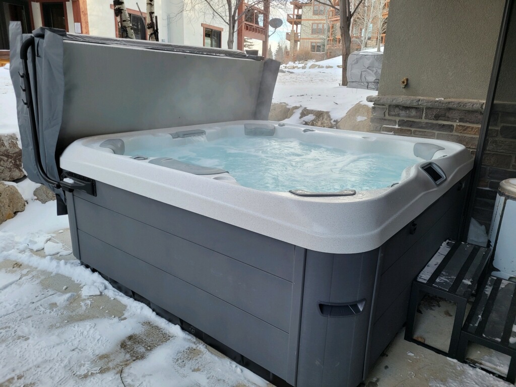 A private hot tub awaits on your patio, surrounded by snow-dusted slopes and ski village charm. Soak in warm bubbling waters after a day on the mountain, with alpine views all around.