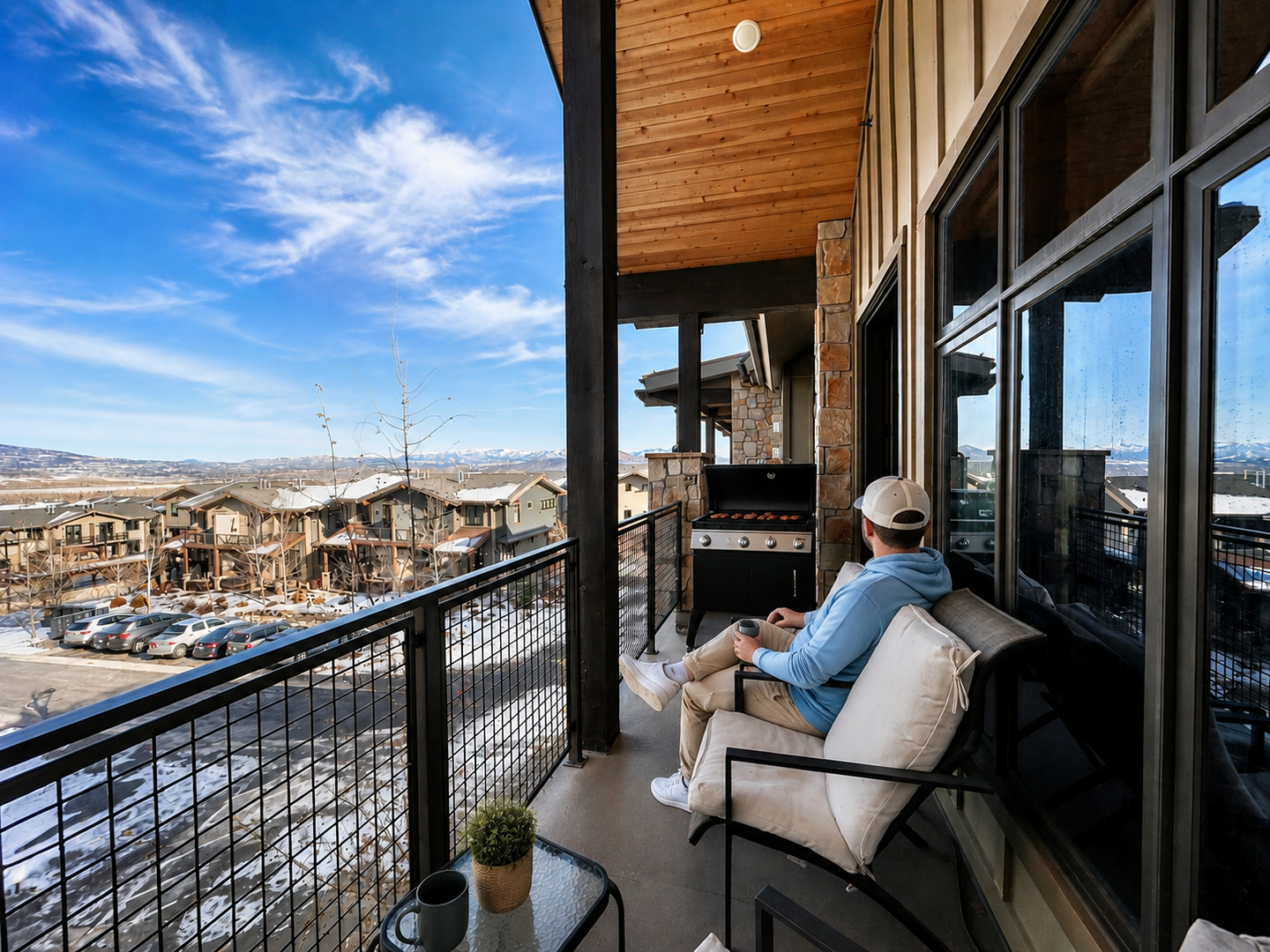 Private covered balcony with mountain views, comfy seating, and your own BBQ grill—perfect for grilling and relaxing while soaking in the fresh air.