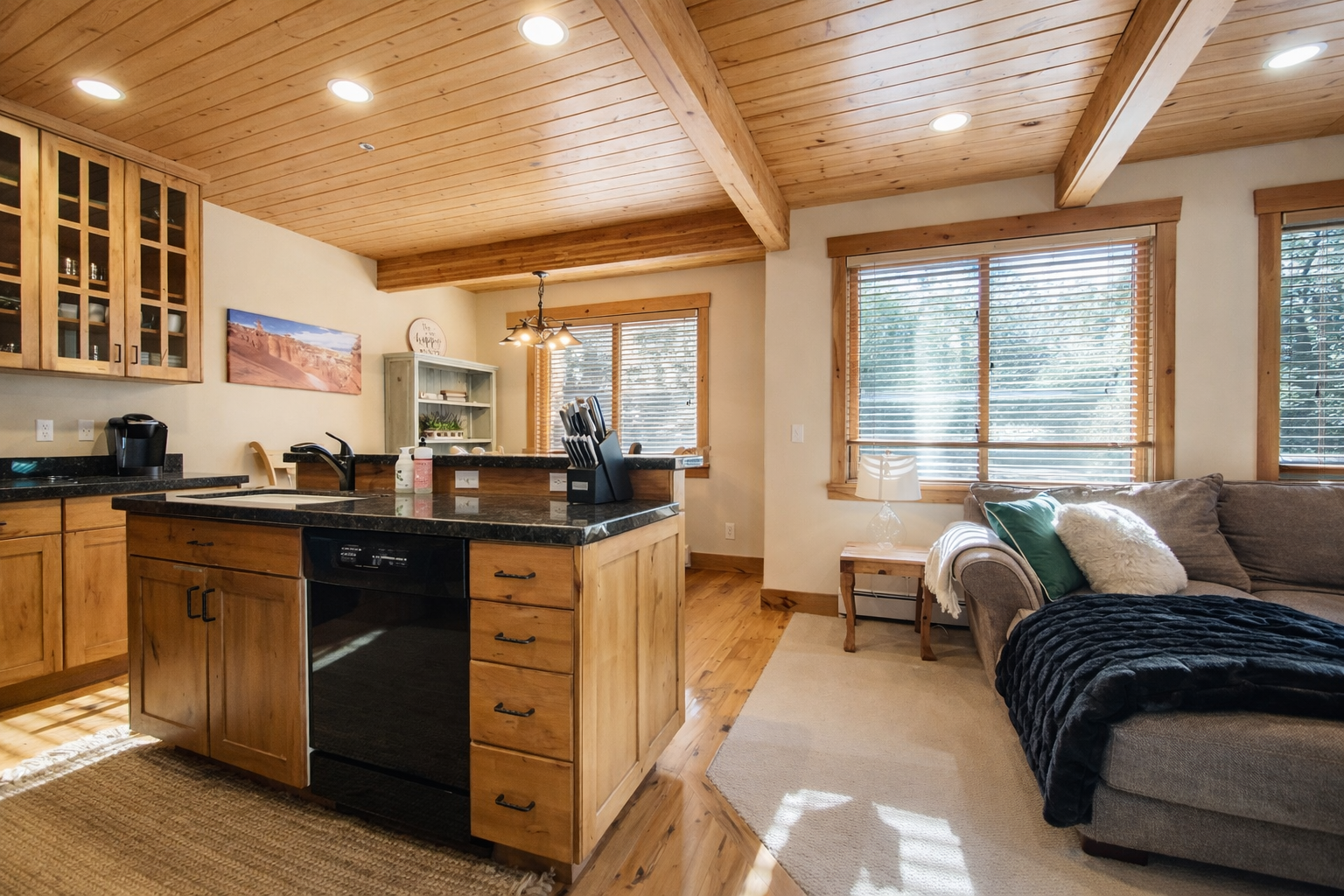 Enjoy this cozy mountain retreat with a fully equipped kitchen and open living space. The wood beams and forest views create the perfect escape.